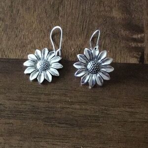 Flower dangle earrings silver in color